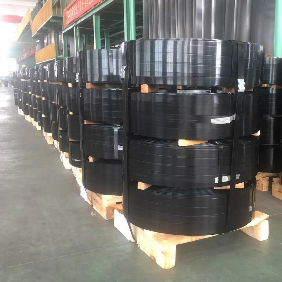 Steel strapping coils Black painted steel strapping coils stacked on pallets in the JUHONG warehouse