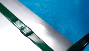 Friction-welded PET strapping joint Close-up of a friction-welded joint on green PET strapping