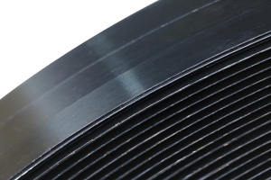 Close Up Detail of Black Lacquered and Waxed Steel Strap Surface with Safety Rounded Edges