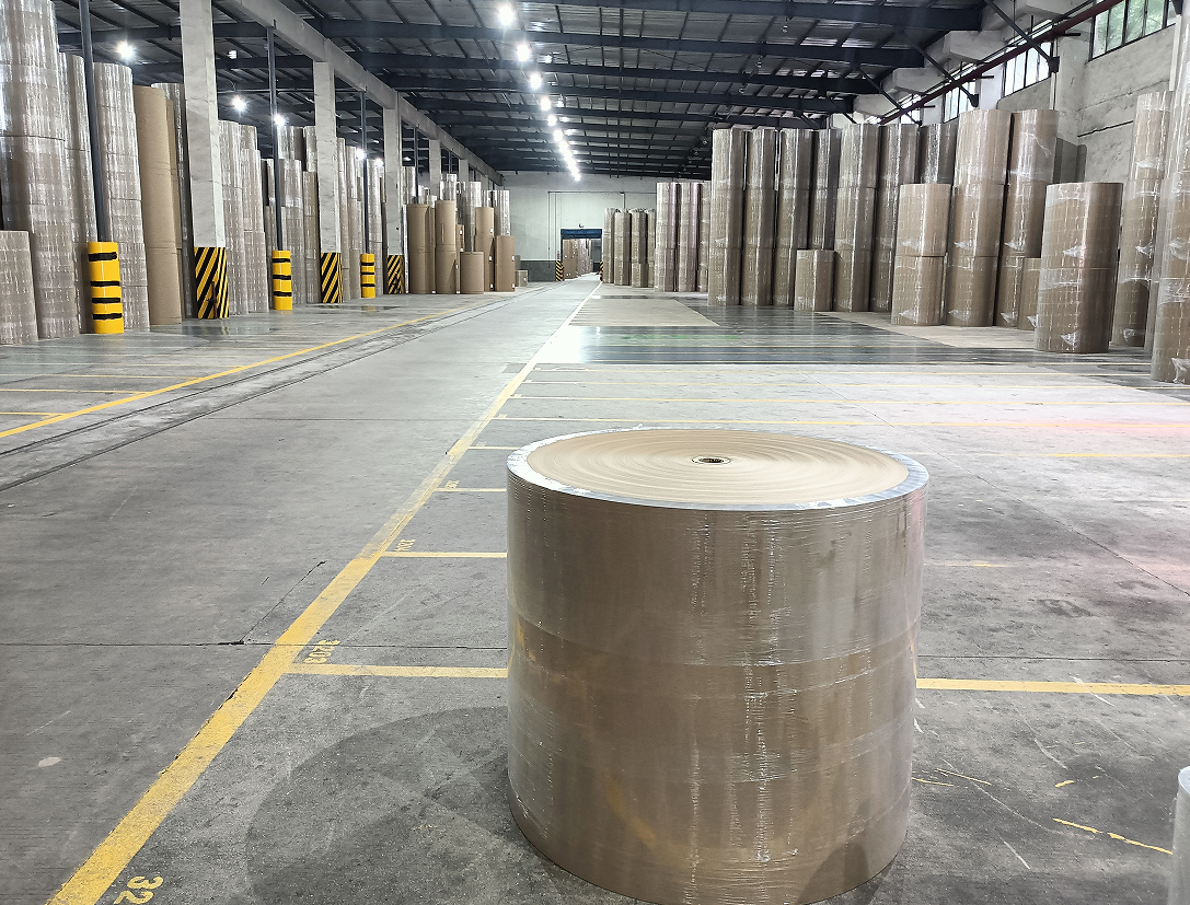 Industrial Stretch Film wrapping massive paper rolls in the Paper Industry manufacturing plant
