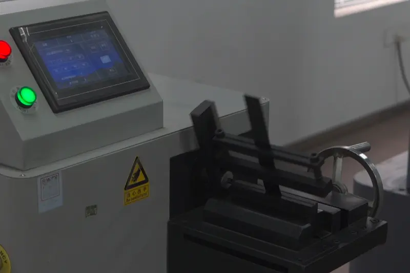 Steel strapping undergoing a repeated-bend test in JUHONG's laboratory