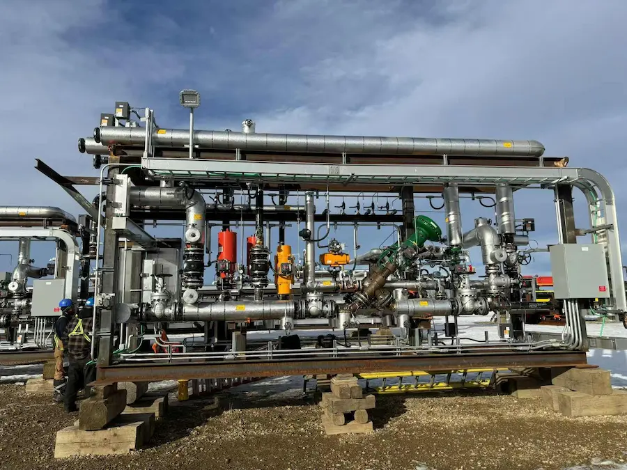 Stainless steel banding securing insulation jacketing on industrial process piping