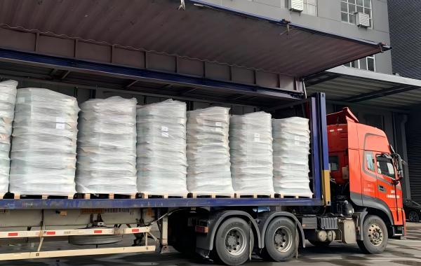 PET strapping and stretch film securing palletized goods inside a truck for transport