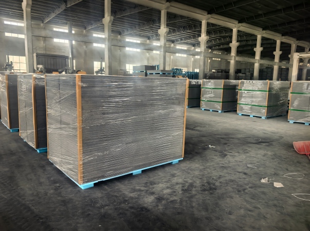 Juhong Packing\'s AAR certified PET strapping (ID: 124) and industrial machine stretch film used to secure and protect gypsum board pallets for the building products industry.